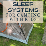 tent in wooded grassy area with text overlay reading "sleep system ro camping with kids"