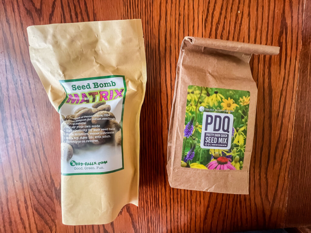 two brown paper bags - one filled with native seeds from Prairie Moon Nursery and the second filled with seed ball matrix